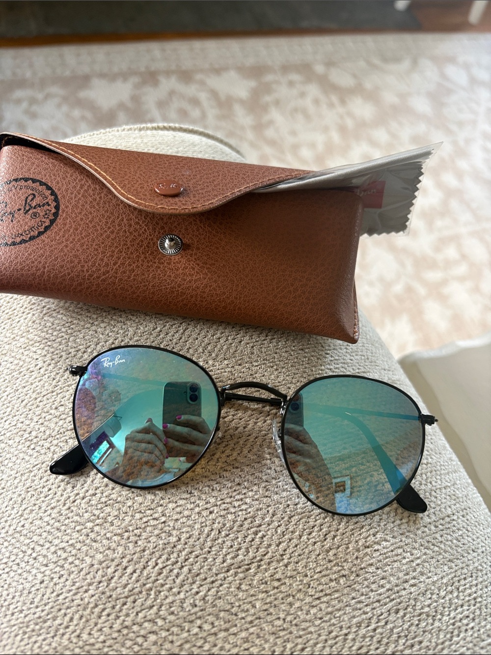 Ray-Ban Black Frame Sunglasses with teal lenses